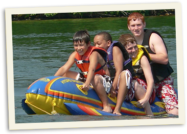 four boys on a raft